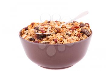 Muesli in the bowl isolated on white background.