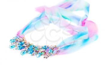 Stylish necklace with colorful ribbon and stones isolated on white background.