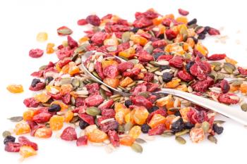 Dried fruits, berries and seeds on white background.