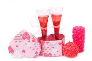 Two glasses, candles, gift box  isolated on white background.