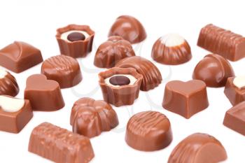 Assortment of chocolate isolated on white background.