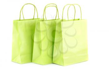 Green shopping bags isolated on white background.