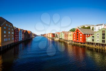 Colorful old houses at the Nidelva river embankment in Trondheim, Norway.