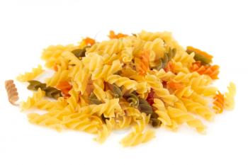 The heap of fusilli pasta isolated on white background.