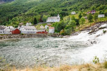 Landscape with village and mountain river in Norway.