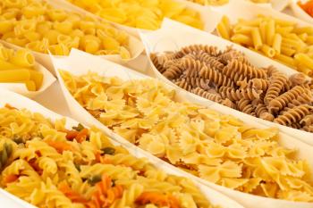 Various kind of Italian pasta in the bamboo bowls.