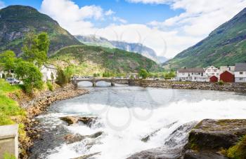 Landscape with mountains, houses, bridge and river in Hellesylt, Norway.