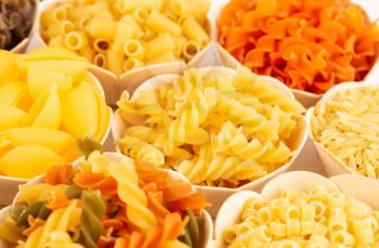 Various kind of Italian pasta in the bamboo bowls.