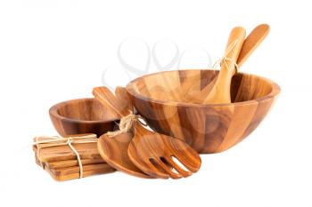 Wooden bowls, spoons, fork and coasters isolated on white background.