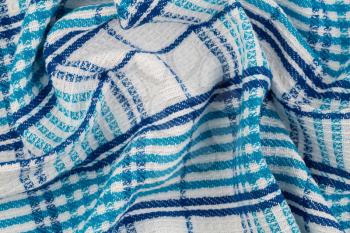 Blue and white kitchen towel texture as a background, horizontal picture.