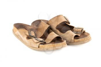 The pair of man old brown leather sandals isolated on white background.