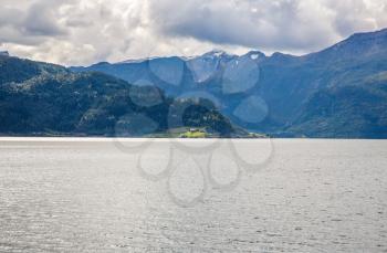 Landscapoe with mountains and fjord in Norway.