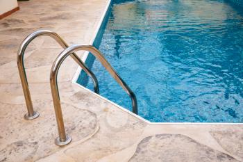 Swimming pool with mosaic pattern.