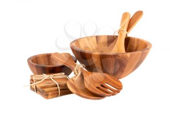 Wooden bowls, spoons, fork and coasters isolated on white background.