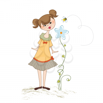 small young lady who smells a flower