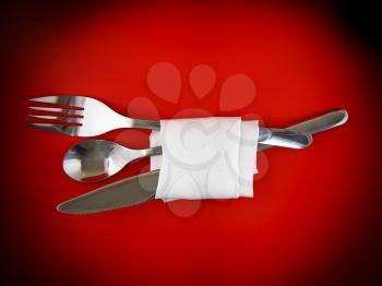 Table serving-knife,plate,fork and silk napkin  on  red colour background.