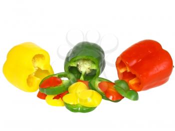 Cutting -yellow, green , red sweet pepper on white background. Isolated