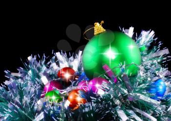  New Year decoration- balls, tinsel .On black background