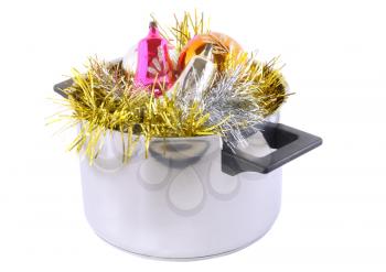 Funny Christmas and New Year-balls,tinsel in  saucepan. Isolated over white