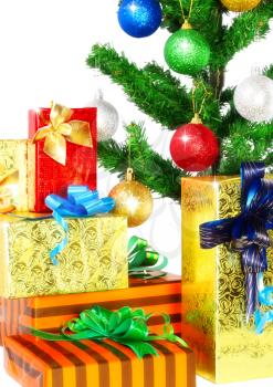 Fragment of Christmas and New Year Tree with gift boxes. Isolated over white background.