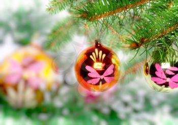 Christmas and New Year decoration- glass balls, green tinsel . Close-Up. On white background, isolated.