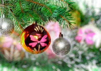 Christmas and New Year decoration- glass balls, green tinsel . Close-Up. On white background, isolated.