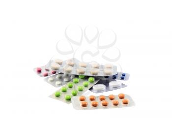 Coloured pills on white background. Isolated over white