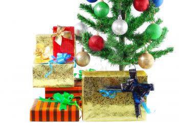 Fragment of Christmas and New Year Tree with gift boxes. Isolated over white background.