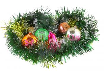 Christmas and New Year decoration- glass balls, green tinsel . Close-Up. On white background, isolated.