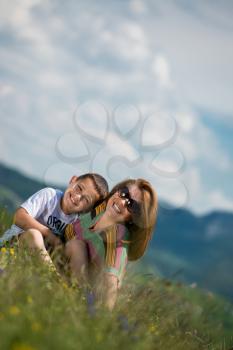 mother with son sitting and spreading love