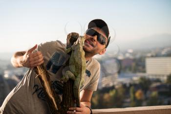 portrait of the young man with the iguana