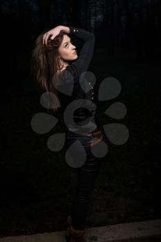 young woman looking up behind her shoulder