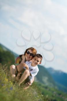 mother with son sitting and spreading love