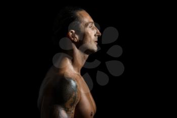 Muscular man in a black background