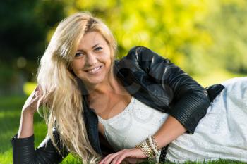 Girl Resting In Meadow
