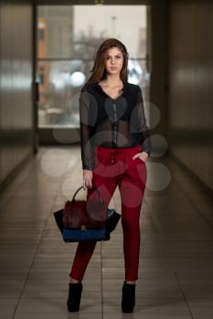 Gorgeous Woman Wearing Red Pants And Chiffon Long Sleeve