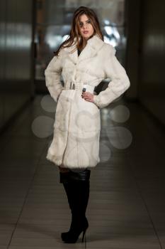 Elegant Lady In White Long Fur Coat