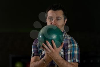 Man Holding A Bowling Ball