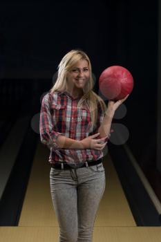 Women Holding A Bowling Ball