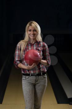 Women Holding A Bowling Ball