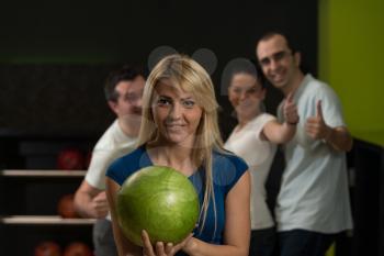 Friends Bowling Together