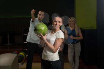Group Of People Bowling
