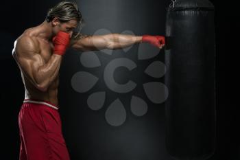 A Man With A Tattoo In Red Boxing Gloves - Boxing On Black Background - The Concept Of A Healthy Lifestyle - The Idea For The Film About Boxing