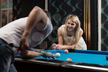 Boy And Girl Flirting On A Pool Game