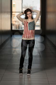 Model Wearing Leather Pants And American Flag Shirt