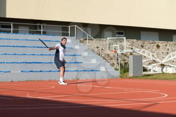 Mature Caucasian Tennis Player During A Match On A Sunny Day