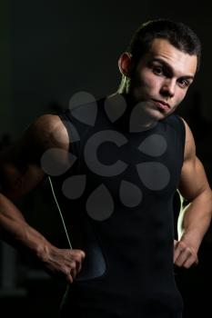 A Muscular Male Model Staring Confidently