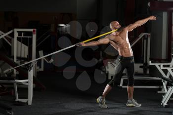 Mature Male Athlete Practicing To Throw A Javelin