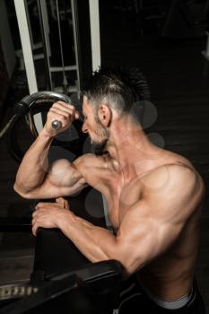 Athlete Man Doing Heavy Weight Exercise For Biceps