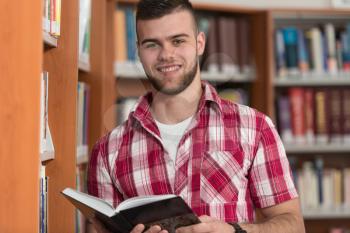 A Portrait Of An Caucasian College Student Man In Library - Shallow Depth Of Field